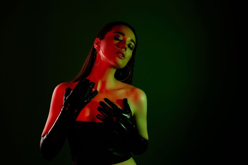 The gorgeous Goddess in black latex gloves demonstrates her passion for femdom and makes every submissive man love female domination.