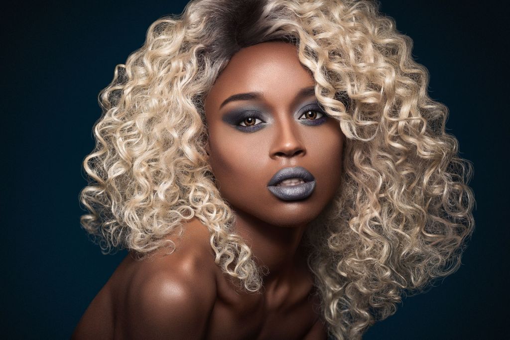 Nude black female with blond curly hair evoke sexual arousal in hair fetishist.