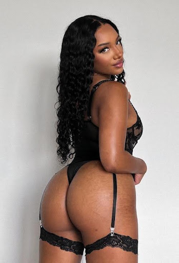 Mistress India Chanel posing her butt in black lace bodysuit.
