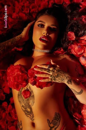 Goddess Valentina Fox lying nude on red rose petals