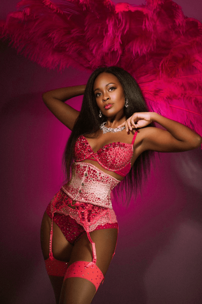 Mistress Divine poses in red lace lingerie and stockings