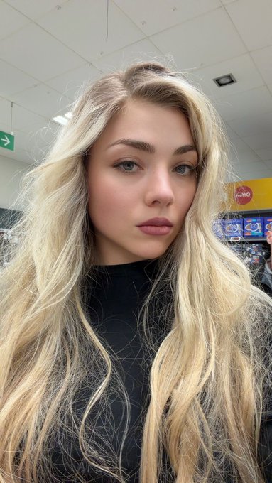 Goddess Xtasia in a convenience store in a black top